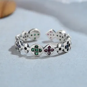 Macro shot of 925 silver ring featuring vintage flower patterns and colorful zircon stones