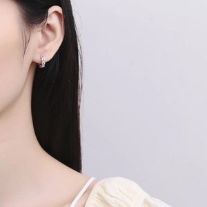Elegant S925 sterling silver wheat ear hoop earrings with micro-pave zirconia on model