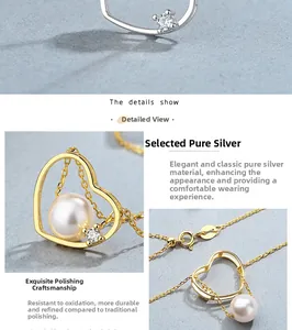 Gros plan sur collier cœur en argent 925 avec perle et fermoir mousqueton