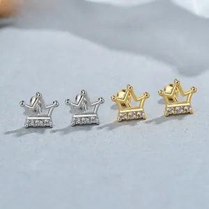 Detailed macro of 925 sterling silver crown screw-back earrings with zircon inlay
