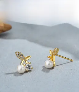 Detail of 925 silver cherry stud earring with pearl, zircon fruit and gold plating