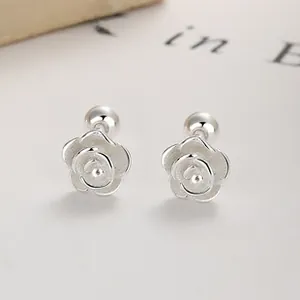 Macro shot of 925 sterling silver rose earrings with screw-back and brushed petals