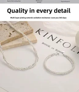 Detailed close-up of S925 silver beaded necklace with freshwater pearls and silver tubes