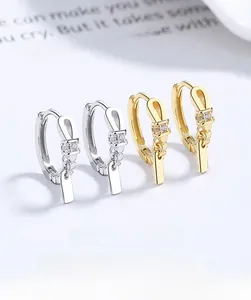 Close-up of twisted 925 sterling silver hoop earrings with shimmering micro-pave diamonds