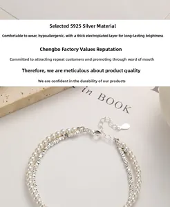 Detailed macro of S925 sterling silver double-layer bracelet with pearls and lobster clasp