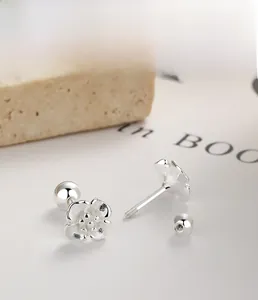 Macro shot of S925 sterling silver cherry blossom earrings with secure screw-back closure