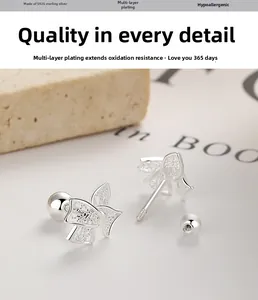 Detail of 925 sterling silver bow earrings with secure screw back and plating texture
