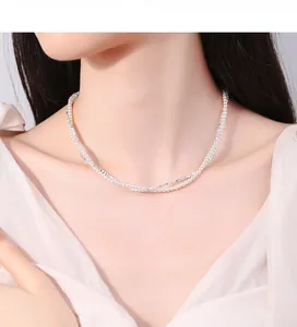 Detail view of 925 sterling silver layered necklace with white pearls and crushed silver beads