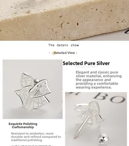 Detailed view of 925 sterling silver bow earrings with secure screw back closure