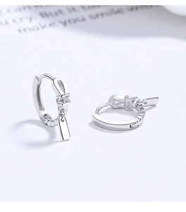 Detailed close-up of 925 sterling silver twist earrings with sparkling zircon inlay