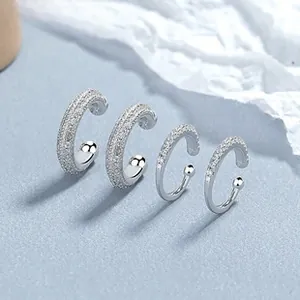 Makro-Detail von 925 Sterling Silber Ohrmanschetten mit geometrischen Zirkoniamustern