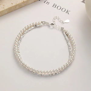 Double-layer 925 silver bracelet featuring small pearls and faceted square beads