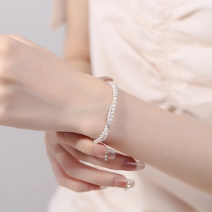 Double-layer 925 silver bracelet featuring elegant pearls and sparkling rhinestones