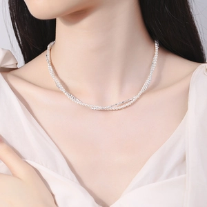 Double-layered 925 silver necklace featuring delicate white pearls and a fine chain style