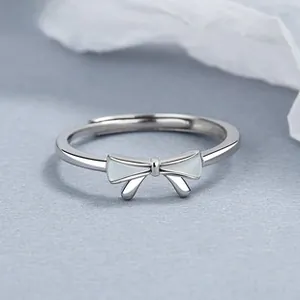 Detailed close-up of 925 silver bow ring with white mother-of-pearl inlay