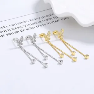 Detail of 925 sterling silver butterfly tassel earrings with sparkling micro-pave crystals
