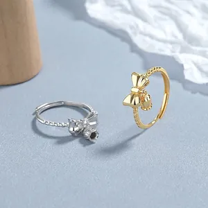925 zilveren lelietje-van-dalen strikringen in goud en zilver met bellenhangers