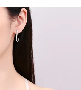 Close-up of 925 sterling silver cauliflower chain stud earrings with pave crystals