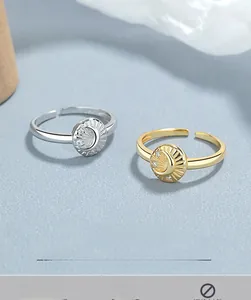 Detailed macro view of S925 sterling silver moon and star engraved adjustable open rings