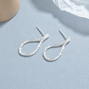 S925 sterling silver twisted teardrop stud earrings with a sparkling textured finish