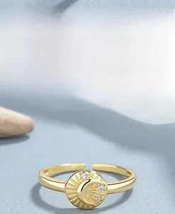 Macro shot of S925 sterling silver moon ring with gold plating and cubic zirconia detail