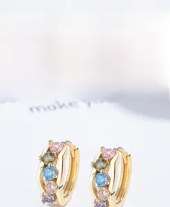 Detailed macro view of S925 sterling silver hoop earrings with colorful zircon stones