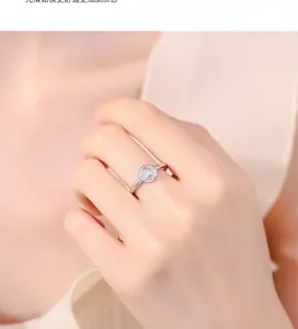 Close-up of 925 sterling silver moon ring with radiant circular texture on finger