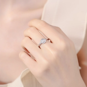 Elegant 925 sterling silver moon relief ring worn on hand with soft warm lighting