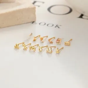 Lot de 12 puces d'oreilles signes du zodiaque en or minimalistes sur fond de pierre blanche