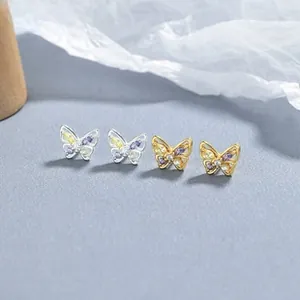Macro di orecchini a farfalla in argento 925 con zirconi viola e finiture dorate
