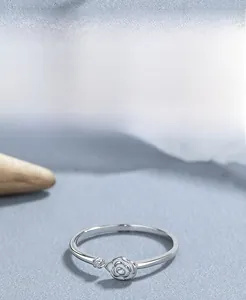 Detail of white rose design on S925 sterling silver ring with a polished finish