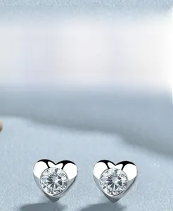 Detailed view of S925 sterling silver heart earrings with sparkling round cubic zirconia