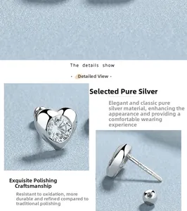 Detailed macro view of S925 sterling silver heart stud earrings with cubic zirconia and screw back