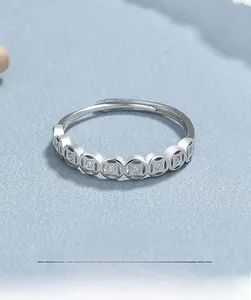 Close-up of S925 sterling silver open ring featuring ancient coin patterns with cubic zirconia