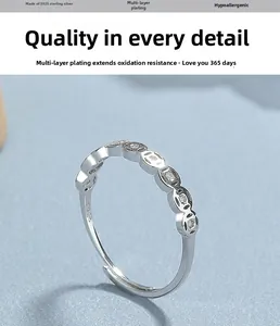 Detailed view of S925 sterling silver ring showing coin motifs and adjustable band