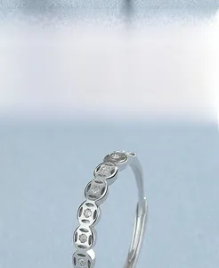 Macro shot of S925 sterling silver coin ring with sparkling micro-set cubic zirconia
