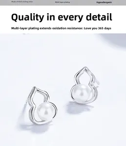 Detail of S925 sterling silver gourd studs with white pearls and polished plating