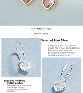 Detail of 925 sterling silver heart earrings with pink and white cubic zirconia stones