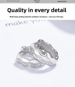 Macro shot of S925 sterling silver hoop earrings with wavy texture and micro-set zircons