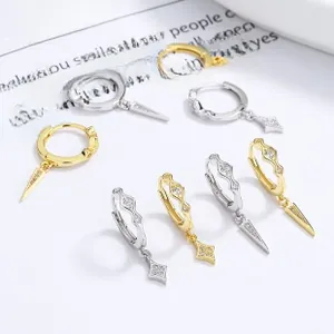 Detailed close-up of 925 sterling silver hoop earrings with spike and star pendants