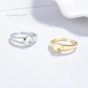 Detailed macro view of adjustable sterling silver starburst rings in gold and silver