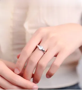 Detail of 925 sterling silver ring with polished starburst engraving and small gemstone