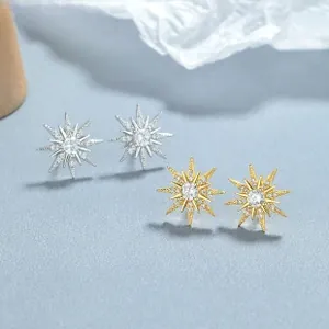 Close-up of S925 sterling silver star stud earrings with cubic zirconia in gold and silver