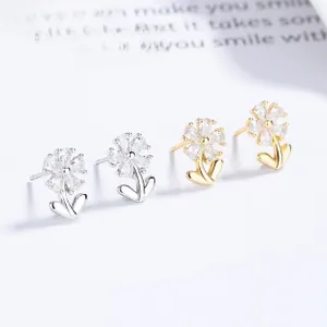 Detailed view of sunflower stud earrings featuring teardrop cubic zirconia in silver and gold