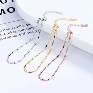 Detailed view of 925 sterling silver chain bracelets in silver, gold and rose gold finishes