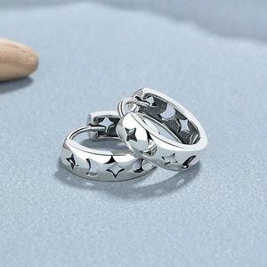 S925 sterling silver huggie earrings with hollow star and moon patterns on grey stone