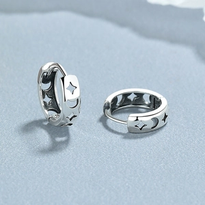 Retro 925 sterling silver hoop earrings featuring hollow star and moon patterns