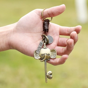 Vintage bronze elephant keychain with braided leather strap and engraved message