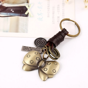 Retro butterfly leather keychain with bronze alloy pendant and inspirational quote tag