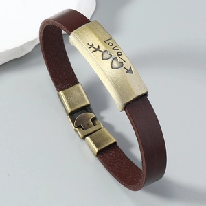 Detail view of leather bracelet with vintage bronze Love arrow metal charm